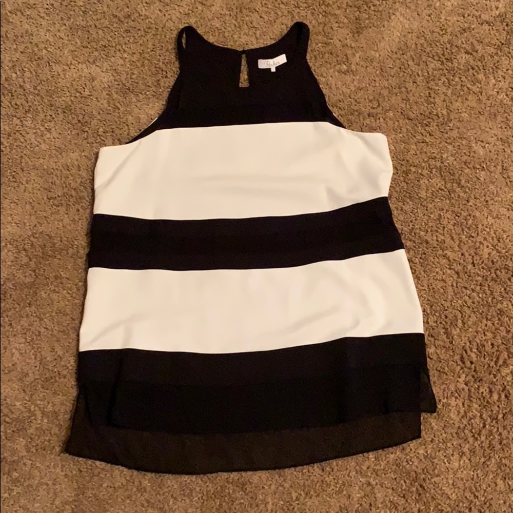 Black and white sleeveless top.